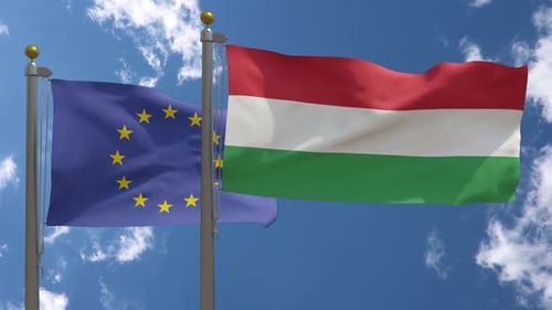European Union Flag Vs Hungary Flag On Flagpole