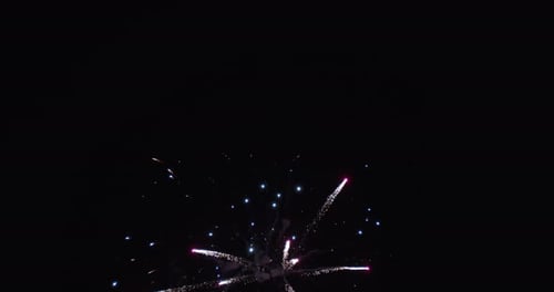 Fireworks Exploding Against Night Sky in Celebration