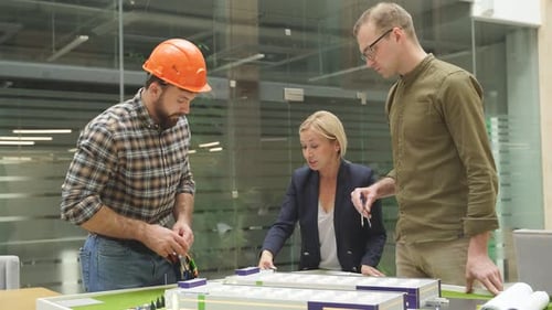 Female Architect Engineers Talking Working Building Complex Prototype Project Together Using 3d