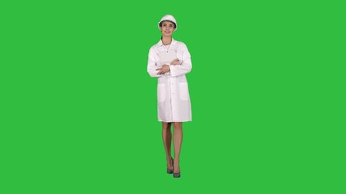 Woman Engineer Holding Tablet Walking on Green Screen