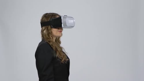 Woman Wearing Virtual Reality Headset in Studio
