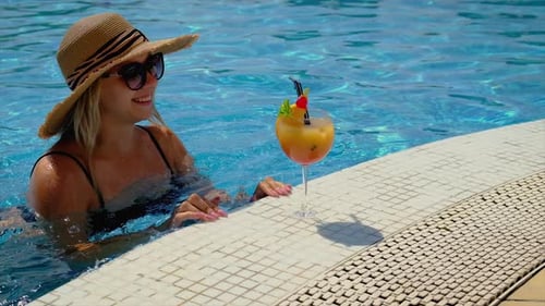 Woman with Cocktail Near the Pool