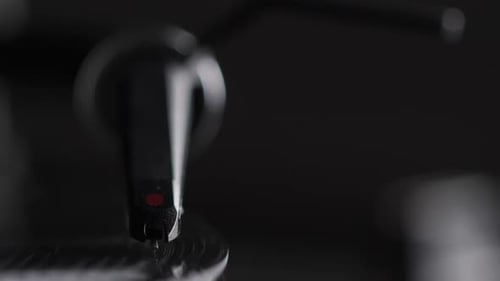Record Player Needle Playing a Vinyl Record