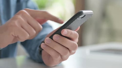 Close Up of Man Using Smartphone Mobile