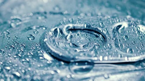 Water Droplets on a Silver Can, Close-Up