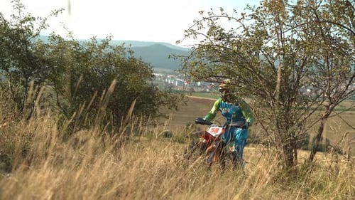 Riding a motocross through the hills
