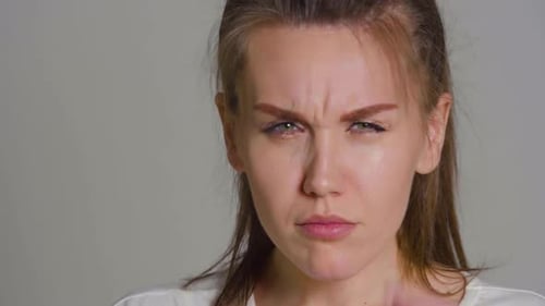 Young Woman Smiling with Yellow Glasses On