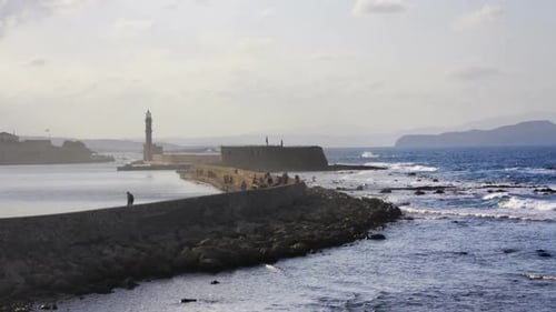 a coastal scene with lighthouse