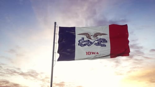 Realistic Iowa State Flag Waving Against a Sunset Sky