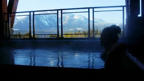 Woman relaxing in swimming pool