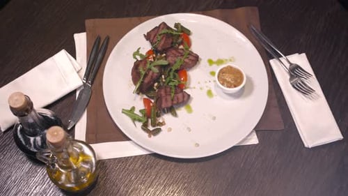 View From Above of Friend Having Dinner in Modern Restaurant with Salad Pork and Dessert