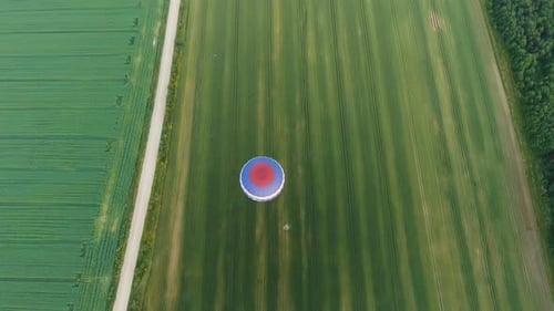 Hot Air Balloon in the Sky Over a Field