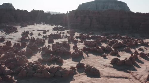 Drone Flying Above Traveler Exploring Red Desert in Goblin Valley Utah