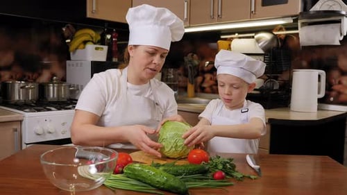 Mother and Child Cooking Fresh Vegetables Together