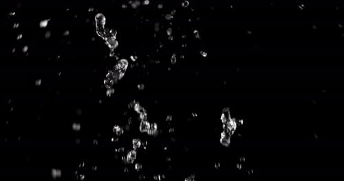 Water Drops and Splashes on Black Background