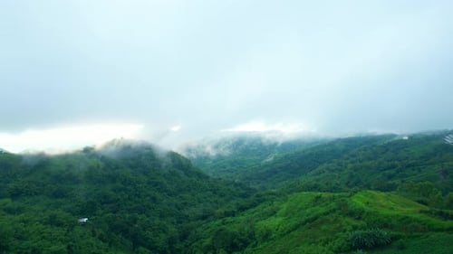 4K Aerial Drone shot flying over beautiful mountain ridge in rural jungle bush forest.