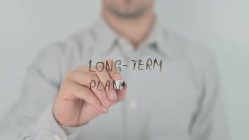 Long Term Planning Writing on Screen with Hand
