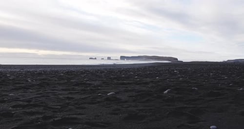 Black Sand Beach And Sea In Iceland