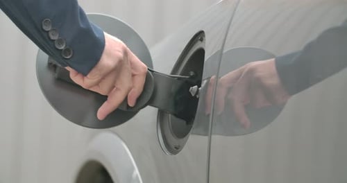 Electric Car Charging Port Opens and Charging Cable Inserted