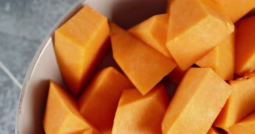 Pieces of Ripe Pumpkin on a Plate To Slowly Rotate.