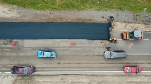 Aerial View Road Service Lays Asphalt on the Road