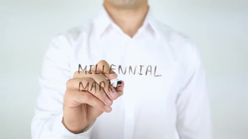 Writing Millennial Marketing on Glass in Business Setting