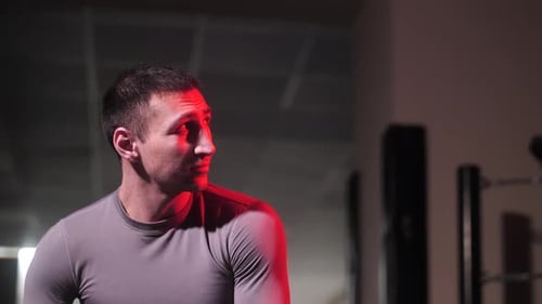 Boxer in a Gray Tshirt Looks To the Side