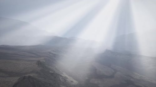 Sun Rays Against the Backdrop of the Mountains