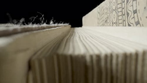 Macro of a Stack of Old Books with Gray Shabby Covers and Yellowed Pages