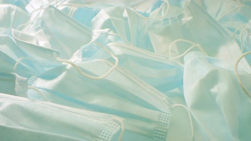 Pile of Disposable Face Masks Close Up