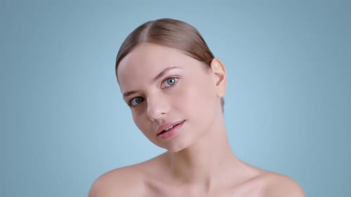 Close Up of Attractive Young Woman Looking to Camera and Moving Her Head