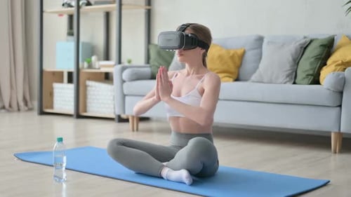 Woman Doing Yoga Using Virtual Reality Headset