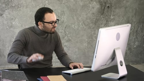 Entrepreneur angry and furious at computer. Reaction to