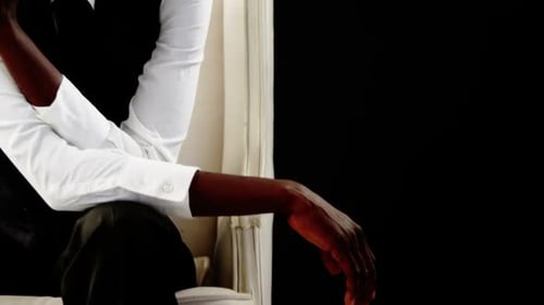 Fashionable Woman Sitting in Elegant Chair