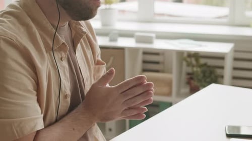 Man Explaining During Online Meeting at Workplace