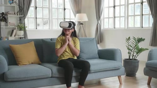 Girl Enjoys Virtual Reality Experience at Home