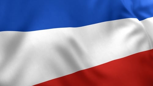 Seamless Looping Animation of Waving Red White and Blue Fabric