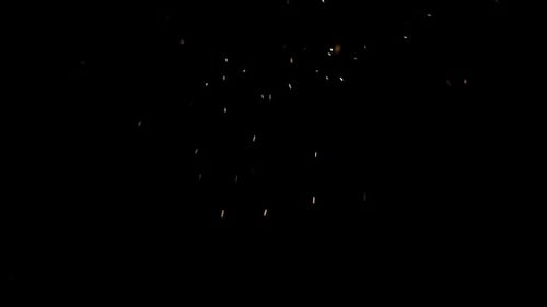 Magical Sparkles and Embers on Black Background