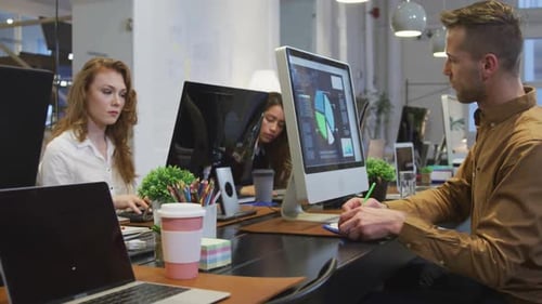 Business people working on computer in office