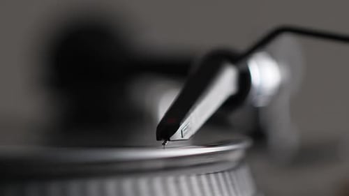 Record Player Needle Spinning on Vinyl Record