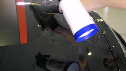 Detailing Glossy Car with Soap and Sponge