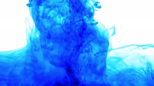 Abstract Blue Ink Swirling Through Water