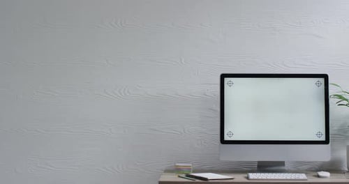 Video of computer on wooden table with copy space in office
