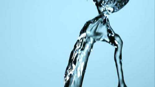 Water pouring and splashing in ultra slow motion 1500fps on a reflective surface - WATER POURS