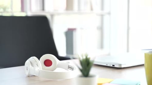 Modern Desk Setup With Laptop and Headphones