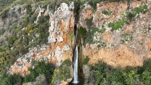 Waterfall in the mountains aerial view 4 K