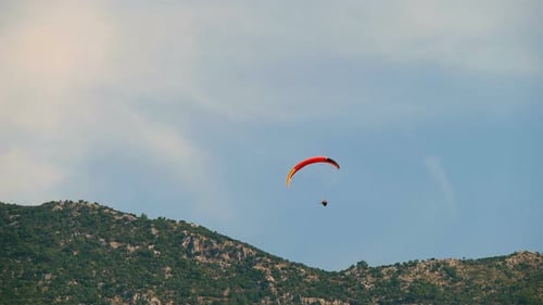 Paragliders Soaring Above Scenic Mountain Landscape