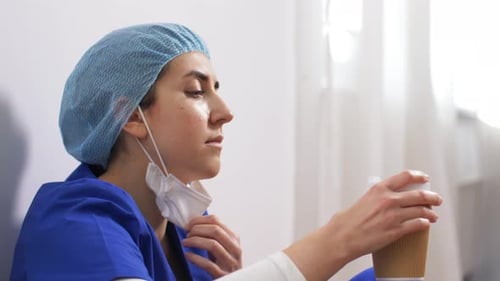 Female Healthcare Worker Taking Coffee Break
