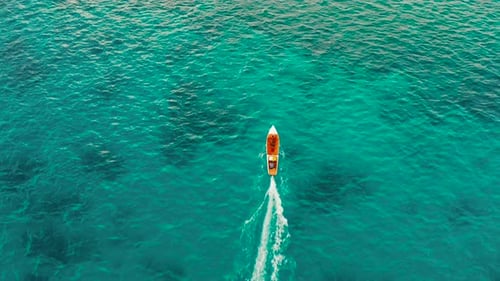 Seascape, Coral Reef and Blue Sea with Motorboat. Balabac, Palawan, Philippines.