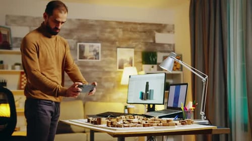 Male Architect Viewing Design on his Phone